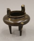 A Chinese gold splash bronze censer. 10 cm high.