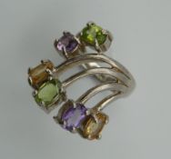 A silver amethyst and peridot ring. Ring Size N.