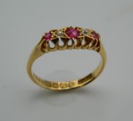 An Edwardian 18 ct gold ruby and diamond gypsy ring. Ring Size M.