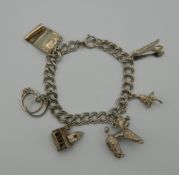 A silver charm bracelet (32 grammes)