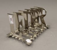 A plated letter rack. 20 cm long.