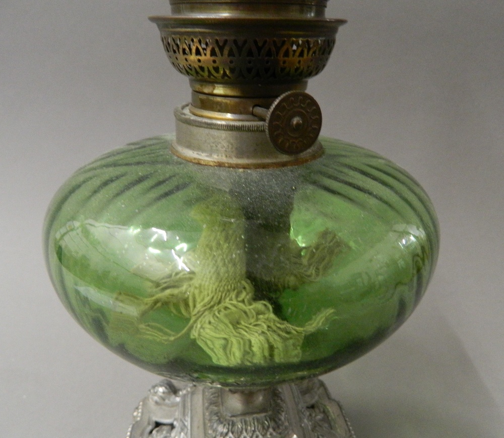 A Victorian oil lamp with green glass reservoir. 52 cm high. - Image 4 of 5