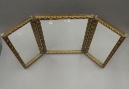 A gilt framed triptych mirror. 50.5 cm high.