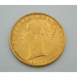 An 1854 Victoria young head shield back sovereign
