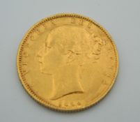 An 1854 Victoria young head shield back sovereign