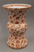 A 19th century Chinese Gu vase decorated with iron red and gilt flowers. 33.5 cm high.