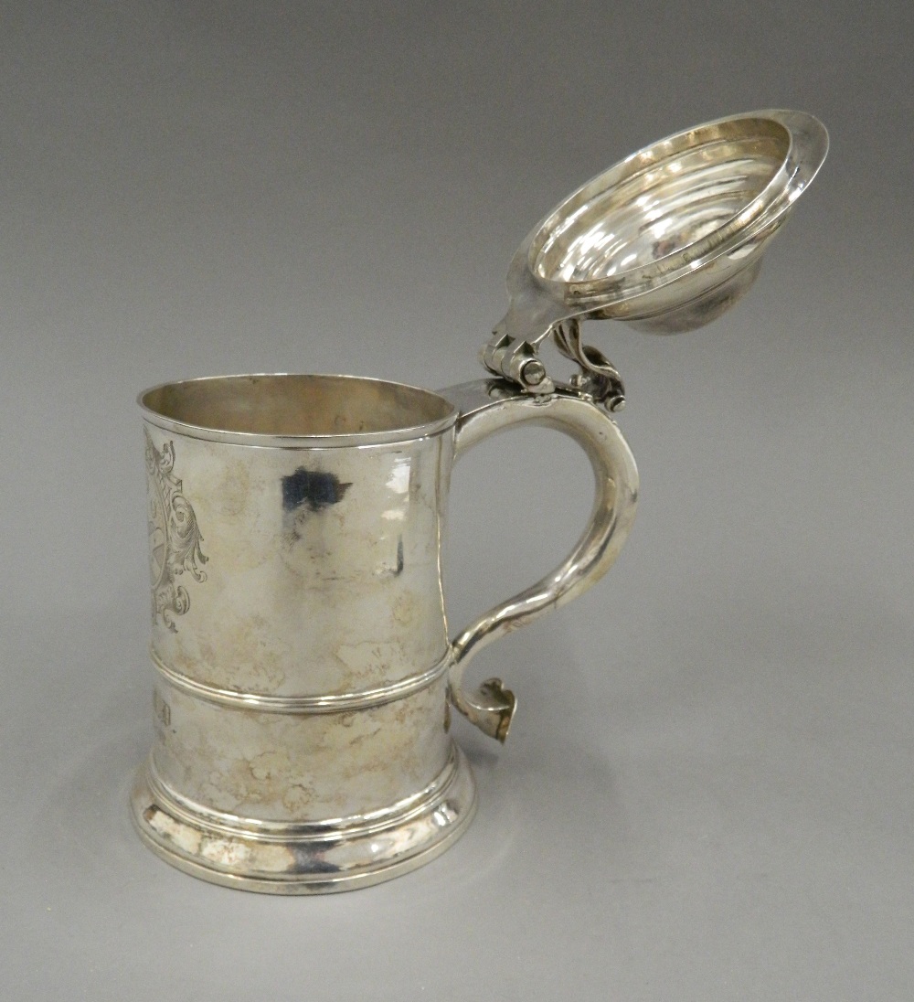 A George II silver lidded tankard, hallmarked for London 1742, maker's mark of F Spilsbury. 17. - Image 5 of 11