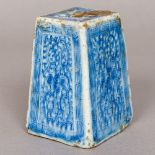 A Chinese blue and white porcelain ink block Decorated in the round with scrolling foliage inside