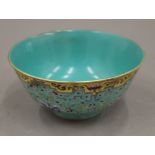 A Chinese turquoise and yellow porcelain bowl. 16.5 cm diameter.