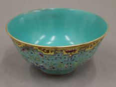 A Chinese turquoise and yellow porcelain bowl. 16.5 cm diameter.