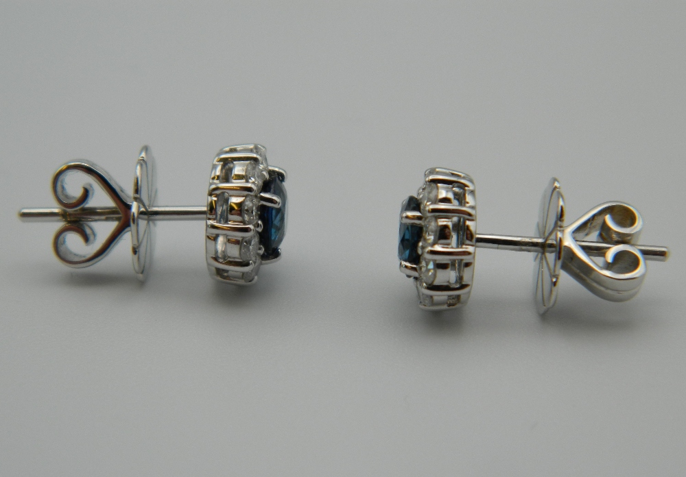 A pair of 18 ct white gold quality diamond and sapphire halo earrings. - Image 3 of 3