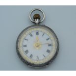 A silver fob watch with engraved case. 3 cm diameter.