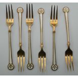 A set of Norwegian enamel decorated silver gilt dessert forks. 13.5 cm long. 106.