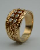 A 14 ct gold eight stone diamond ring. Ring Size T. 9.5 grammes total weight.