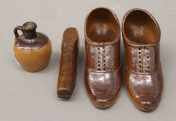 A pair of salt glaze shoes, a treen shoe and a miniature Doulton ewer. The former each 11.5 cm long.