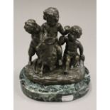 A patinated bronze Bacchic group on a marble plinth base. 18 cm high.