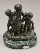 A patinated bronze Bacchic group on a marble plinth base. 18 cm high.