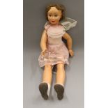 A large vintage doll. 85 cm tall.