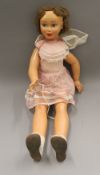 A large vintage doll. 85 cm tall.