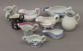 A quantity of 18th/19th century porcelain sauce boats and jugs. The largest 20 cm wide.