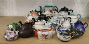 A collection of 19th/20th century porcelain teapots. The largest 14 cm high.