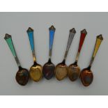 A boxed set of Norwegian enamel coffee spoons. The box 13 cm wide.