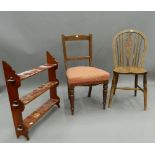 A Victorian mahogany hanging shelf and two dining chairs. The former 67 cm wide.