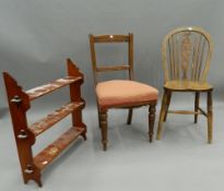 A Victorian mahogany hanging shelf and two dining chairs. The former 67 cm wide.