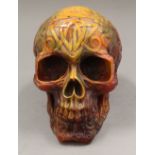 A model skull. 12.5 cm high x 10 cm wide.