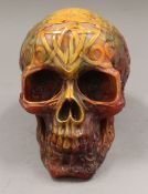 A model skull. 12.5 cm high x 10 cm wide.