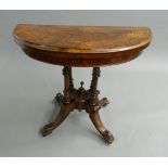 A Victorian walnut demi-lune card table. 89 cm wide.