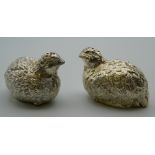 A pair of silver plate cruets formed as partridges. Each 6 cm long.