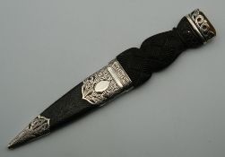 A Scottish silver mounted Skean Dhu, in a leather scabbard, hallmarked for Edinburgh 1910,
