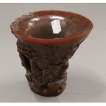 A libation cup. 14 cm high.