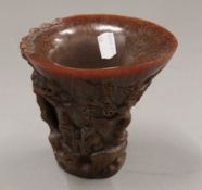 A libation cup. 14 cm high.