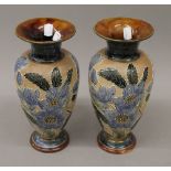 A pair of Doulton Lambeth blue flower vases. 28 cm high.