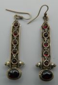 A pair of 925 silver and garnet earrings. 5.5 cm high.