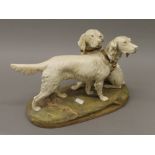 A Royal Dux porcelain model of two retrievers. 36 cm wide.