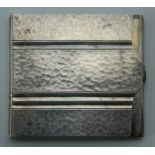 A white metal card case, marked Alpacca. 5.25 cm wide. 39.9 grammes.