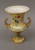 A Royal Worcester blush ivory Campana urn. 19 cm high.