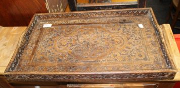 An Eastern carved wooden tray. 54.5 cm wide.