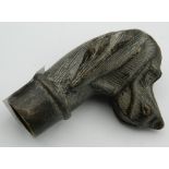 A bronze walking stick handle formed as a dog's head. 7 cm high.