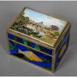 A Russian silver malachite, lapis and agate inset box, the hinged lid painted with a river scene,