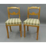 A pair of late 19th century Biedermeier style chairs. 39 cm wide. The property of Germaine Greer.