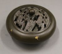 A gold splash bronze lidded censer. 9 cm diameter.