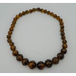 A bead necklace. 60 cm long.