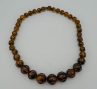 A bead necklace. 60 cm long.