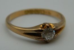 An 18 ct gold diamond solitaire ring. Ring Size N/O. 3 grammes total weight.