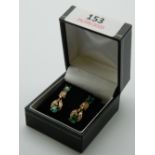 A pair of vintage 18 ct gold emerald and diamond earrings. Each 2.5 cm high.