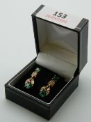 A pair of vintage 18 ct gold emerald and diamond earrings. Each 2.5 cm high.